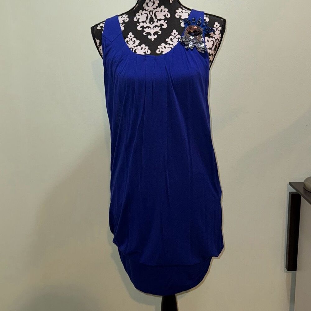 Romeo and Juliet couture blue dress  it has a sequin flower on the left strap of